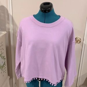 Lavender pinkish sweater with pompoms